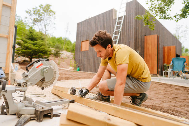 istock Portrait of a carpenter while measuring a wooden plank 1435281669