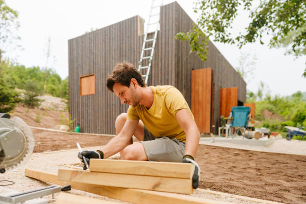istock Portrait of a carpenter while measuring a wooden plank 1435281753