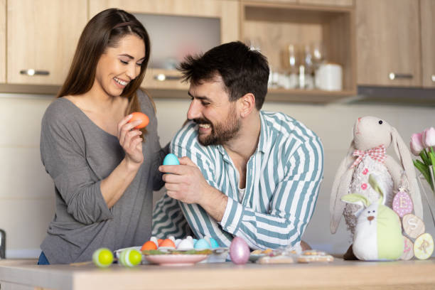 istock Lovely young couple at home doing Easter activities 1435281807