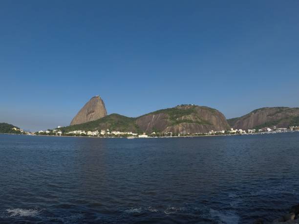 istock Low-angle of a Sugarloaf Mountain peak with a seascape view, clear sky background 1435283752