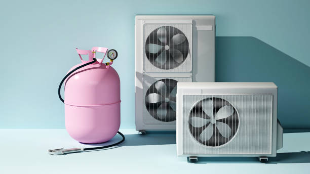 istock pink tank for refilling freon next to the air conditioning system 1435284330