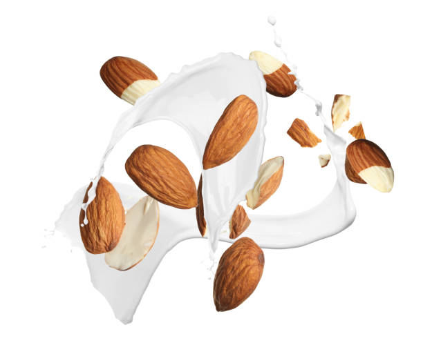 istock Delicious almond milk and nuts on white background 1435284412