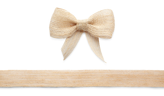 Pretty burlap bow and ribbon on white background