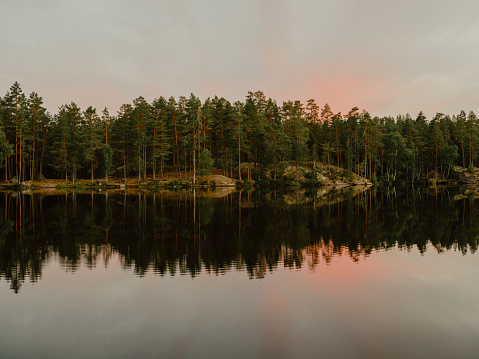 Beautiful lake at sunset in Sweden
calm water in pastel