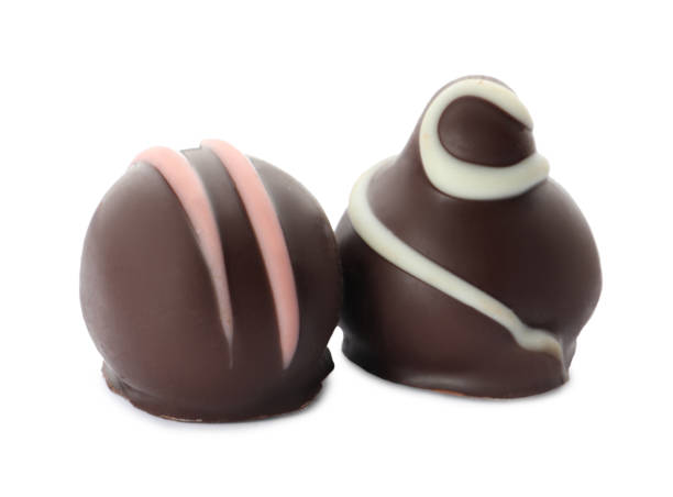 istock Different delicious chocolate truffles on white background 1435284887