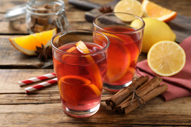 istock Aromatic punch drink and ingredients on wooden table 1435285799