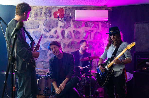Music band having a rehearsal in studio