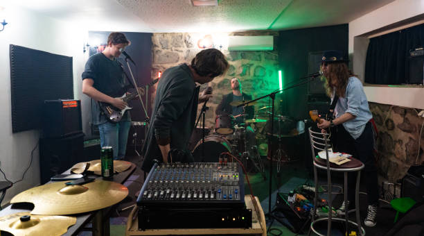 Music band having a rehearsal in studio