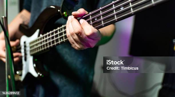 Unrecognizable Male Playing Bass Guitar Stock Photo - Download Image Now - Bass Guitar, Abstract, Adult