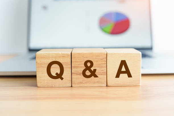 istock Questions and Ask wood block and laptop computer with graph background. FAQ, frequency asked questions, Answer, Q and A, Information, Communication, questionnaire and Brainstorming Concepts 1435290011