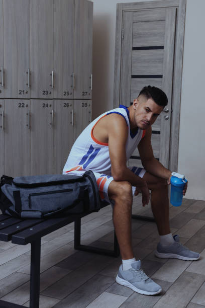 istock Handsome man with shaker in locker room 1435291555