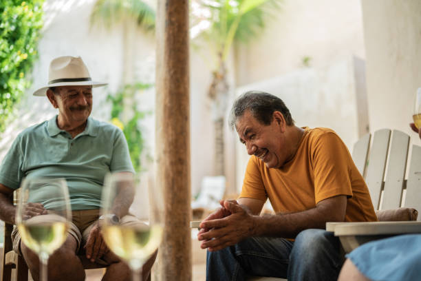 istock Senior friends talking in the backyard at home 1435291818