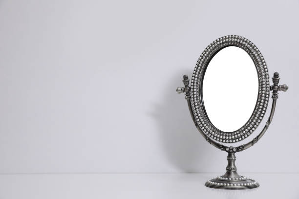 istock Silver vintage mirror with stand on white background, space for text 1435295001