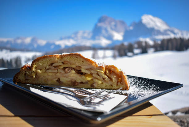 Strudel or apple cake in the mountains Traditional sweet cake made of apples is the favorite dessert in tyrol region and Dolomites . It is called strudel here apple strudel stock pictures, royalty-free photos & images