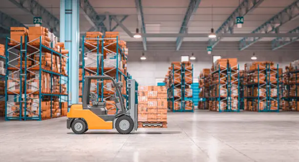 Photo of forklift with pallets inside a warehouse.