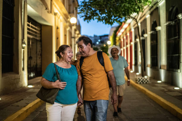 istock Mature couple talking while walking around the historic district with friends 1435299048
