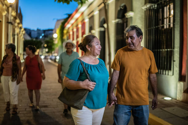 istock Mature couple talking while walking around the historic district with friends 1435299080
