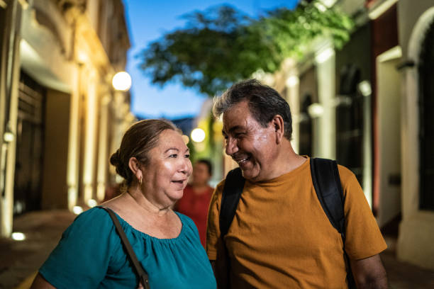 istock Mature couple talking while walking around the historic district with friends 1435299112