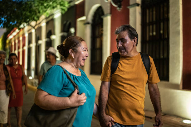 istock Mature couple talking while walking around the historic district with friends 1435299116