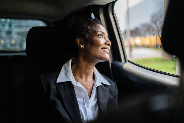 istock Mature woman looking through the window in a car 1435299509