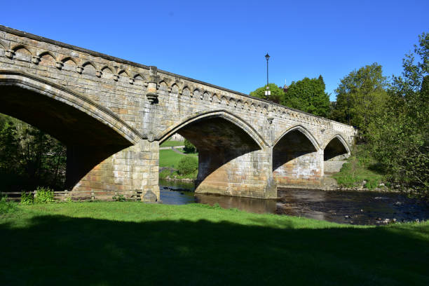 istock Beautiful Old Stone Archway Bridge Over a River 1435301889