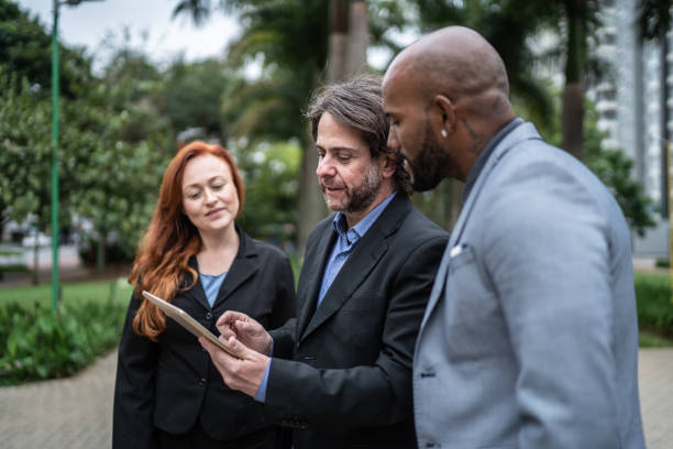 istock Business people doing a meeting outdoors 1435302887