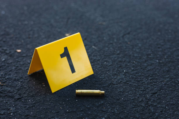istock Crime Scene Marker Next To Bullet Casing 1435303749