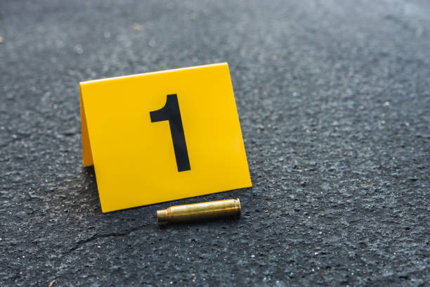 istock Crime Scene Marker Next To Bullet Casing 1435303807