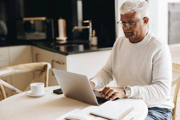 istock Mature businessman working from home 1435304774