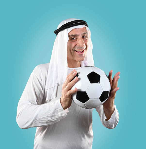 istock Arab man holding a soccer ball 1435304976