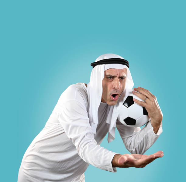 Arab man holding a soccer ball