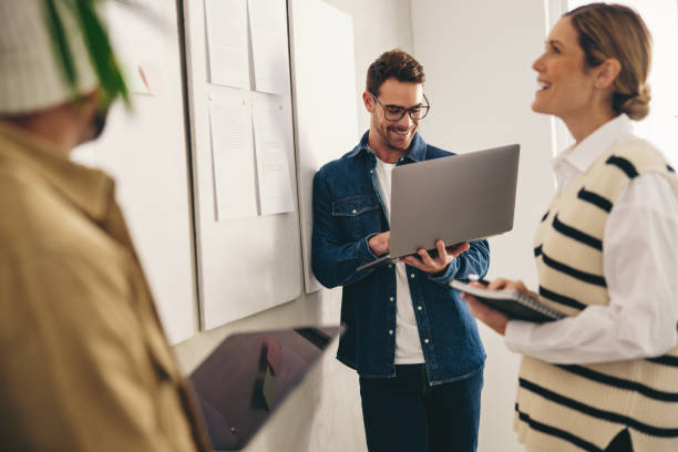 istock Happy business team having a meeting in a creative office 1435311611