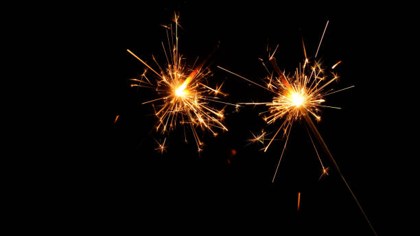 istock sparkler celebrating new year at night on black background 1435311931