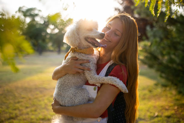 istock Woman holding her dog 1435312154