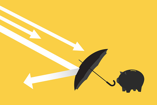 piggy bank behind umbrella to cover and protect from downturn arrow. Protection or defensive stock in economy crisis