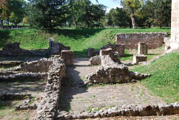 istock Ruins at a park with green grass and trees in the background. 1435316032