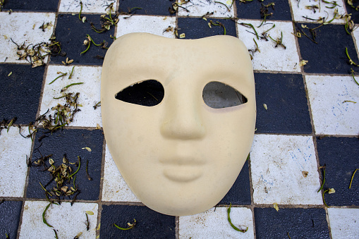 Venetian mask on white with soft shadow.