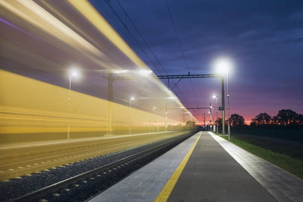 istock Light trail of high speed train on railroad track 1435319932
