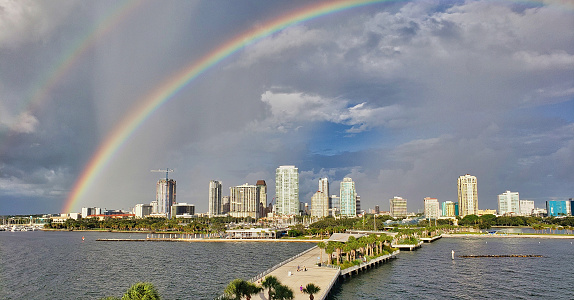 A double rainbow over the St. Petersburg, Florida waterfront with the St. Pete Pier in the foreground.