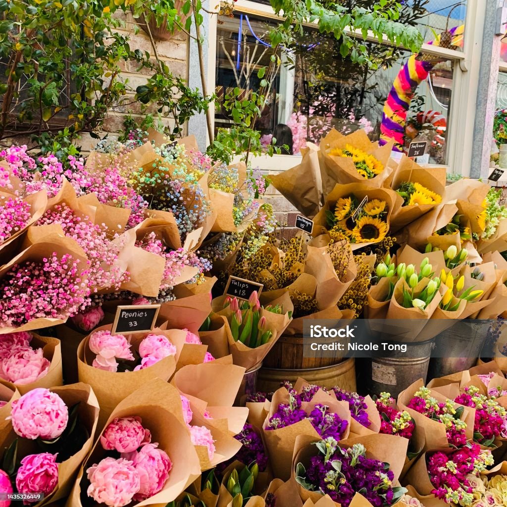 Flowers at a market Vibrant bouquets Flower Market Stock Photo