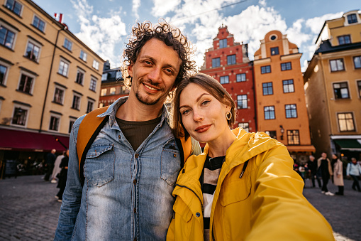 Beautiful young couple taking a selfie in Stockholm, Sweden.