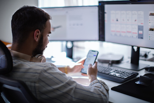 Computer programmer testing a new software program.