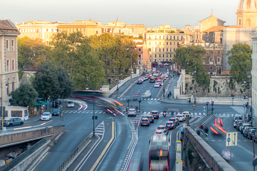 Cars traffic in the city of Rome, Italy. Square at evening