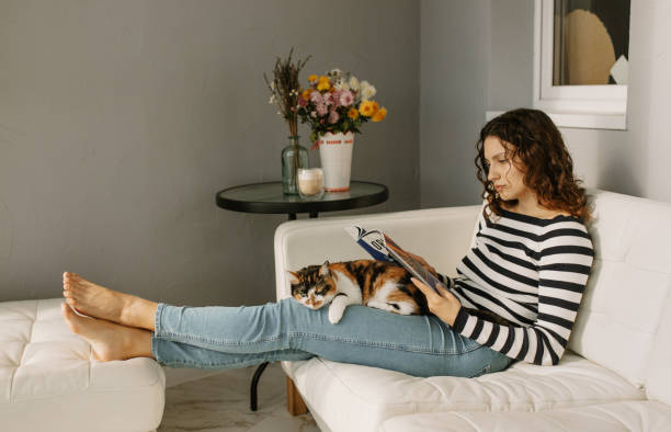 istock Young woman is reading 1435334050