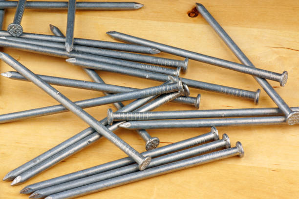istock Rivets over a wooden background 1435336858