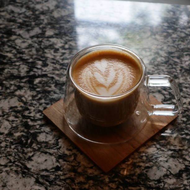 istock a cup of hot cappuccino on a wooden table 1435338521