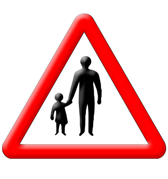 istock Children with parents crossing traffic sign 1435341494