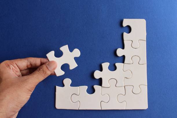 istock Top view image of incomplete jigsaw puzzle 1435341824