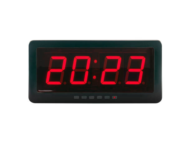 red led light numbers 2023 illuminated on black digital electric alarm clock display isolated on white background