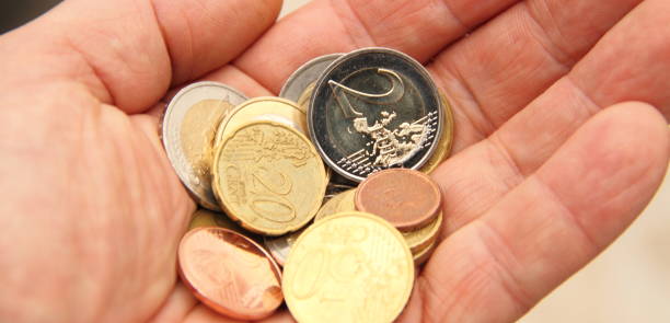 istock a handful of small money 1435343007